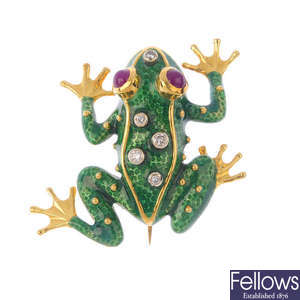 An enamel, ruby and diamond frog brooch.