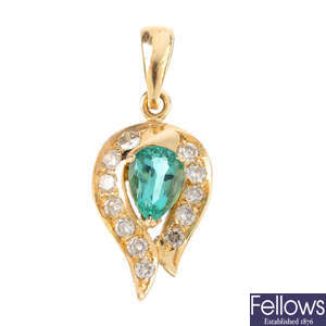 A beryl and diamond pendant.