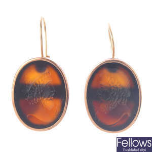 A pair of intaglio hardstone ear pendants.
