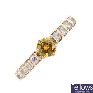 A 14ct gold coloured diamond and diamond ring.
