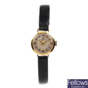 BUCHERER - a lady's yellow metal wrist watch.